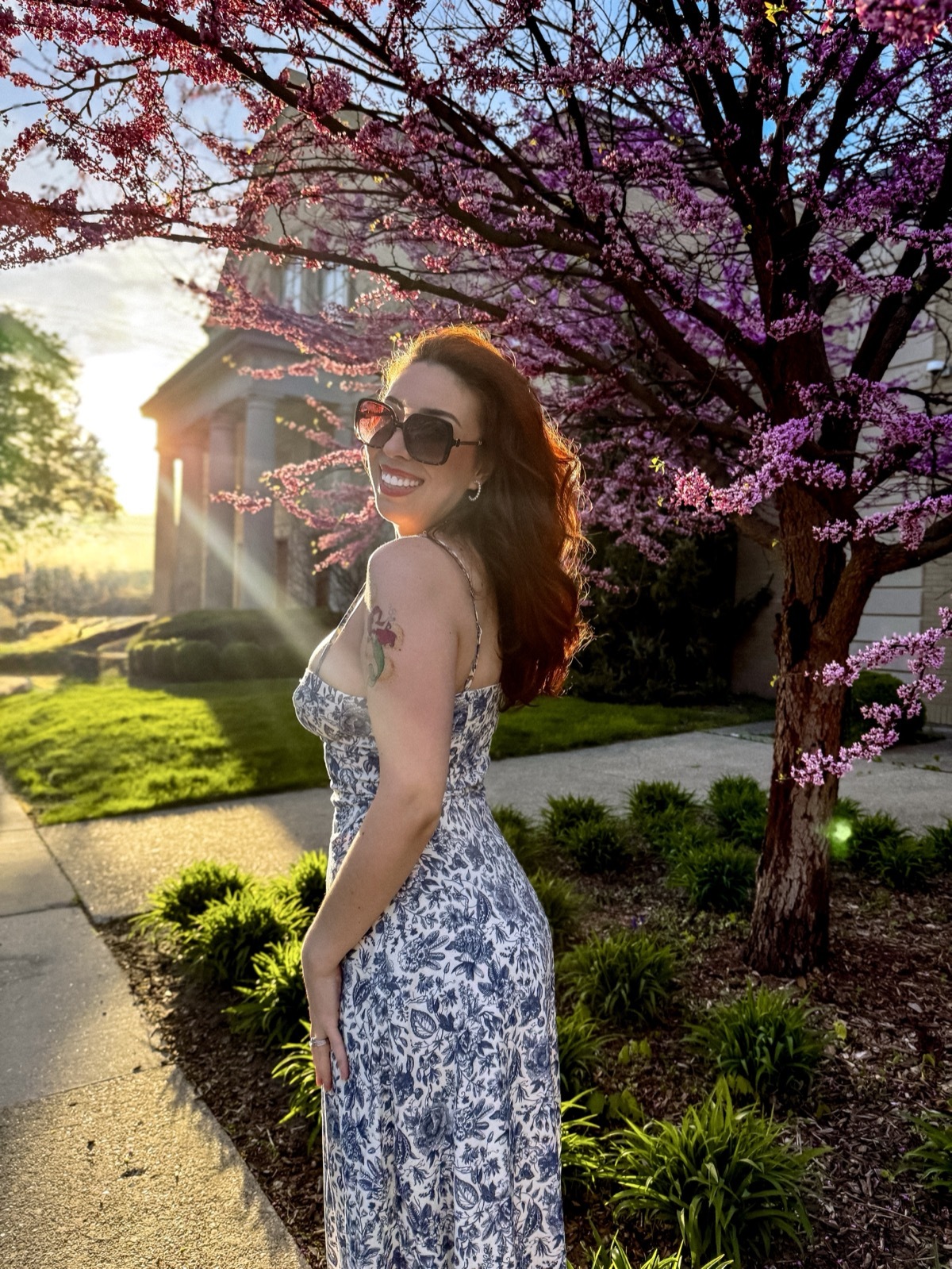 Bianca Fortney in a pink floral dress, featured as a fashion, beauty, and UGC creator in Grand Rapids